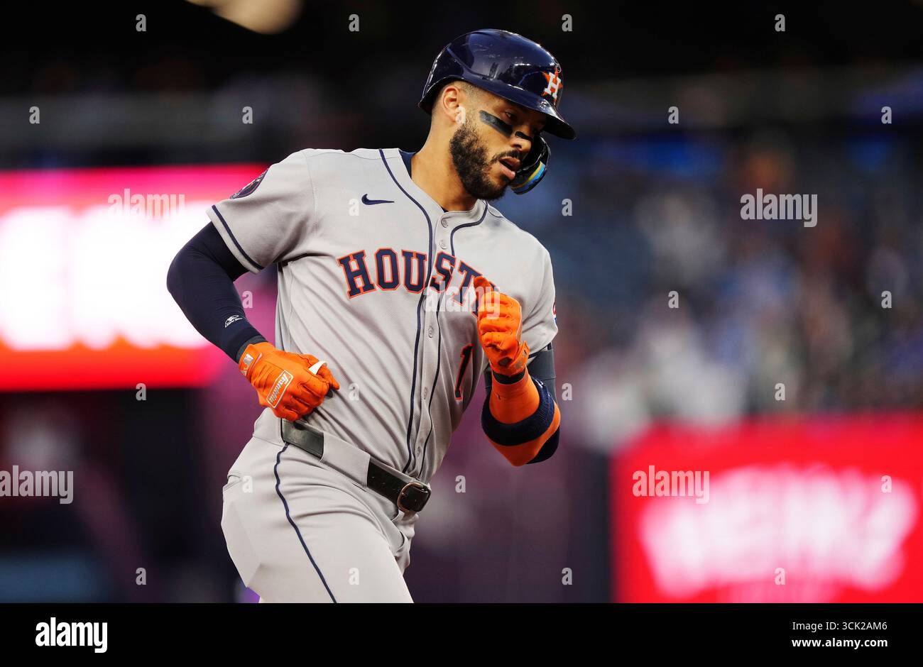 Houston Astros' Carlos Correa (1) rounds the bases after hitting a two ...