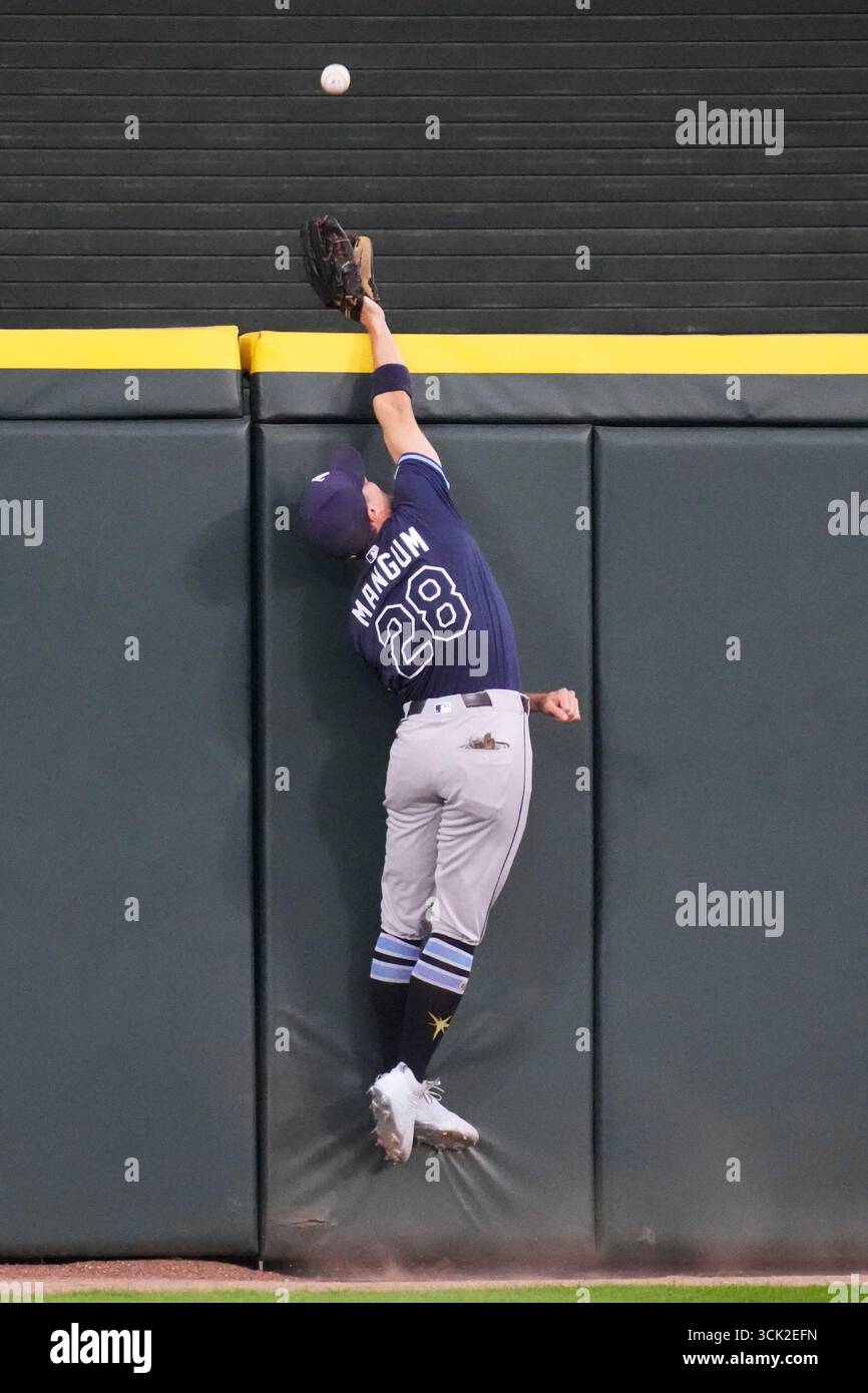 Tampa Bay Rays center fielder Jake Mangum can't make the play on a solo ...
