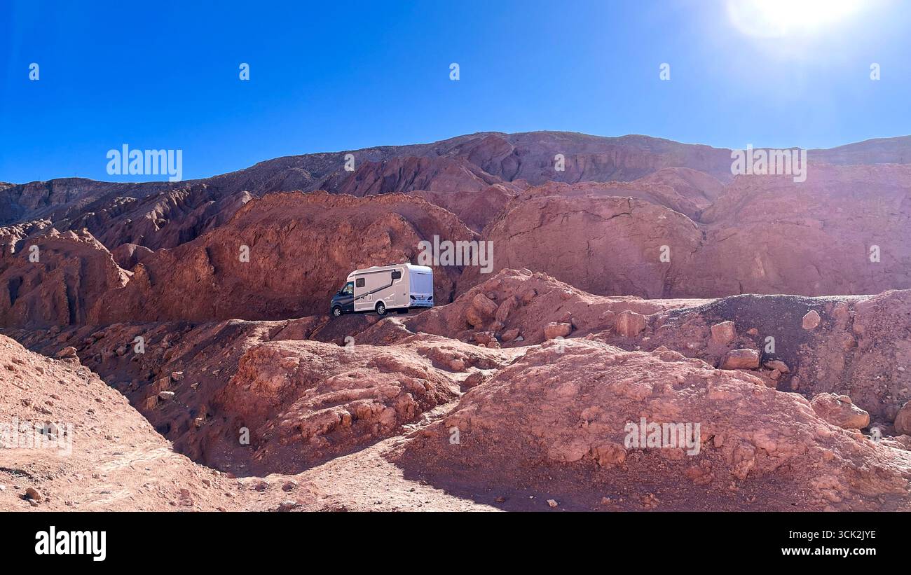 Modern RV motorhome, while standing in unique sand rocky desert ...