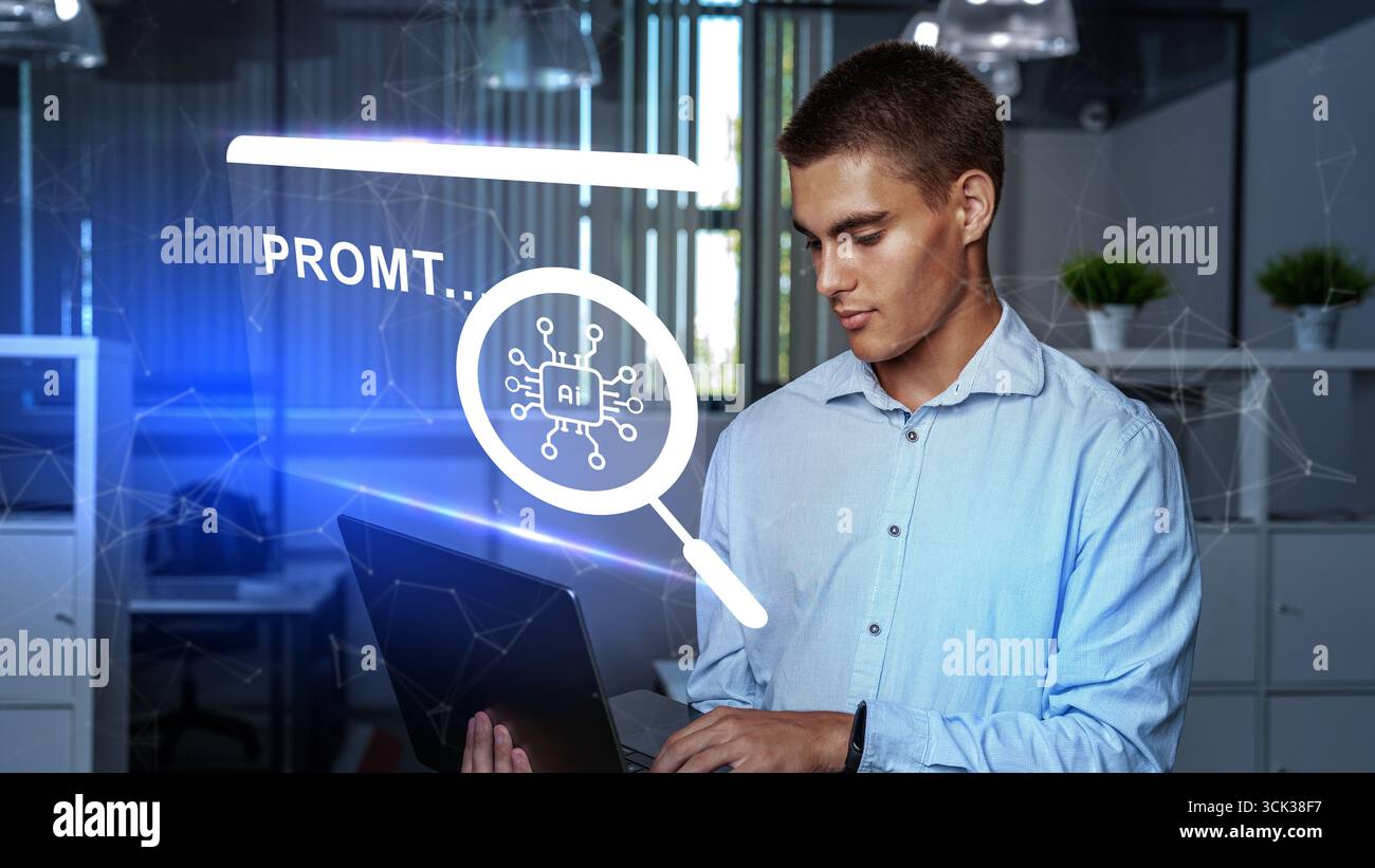 Young man working with laptop in modern office while exploring artificial intelligence applications Stock Photo
