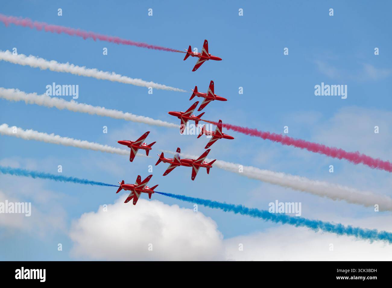 Nine BAE Hawk Jet Trainers of the RAF Red Arrows perform the dangerous ...