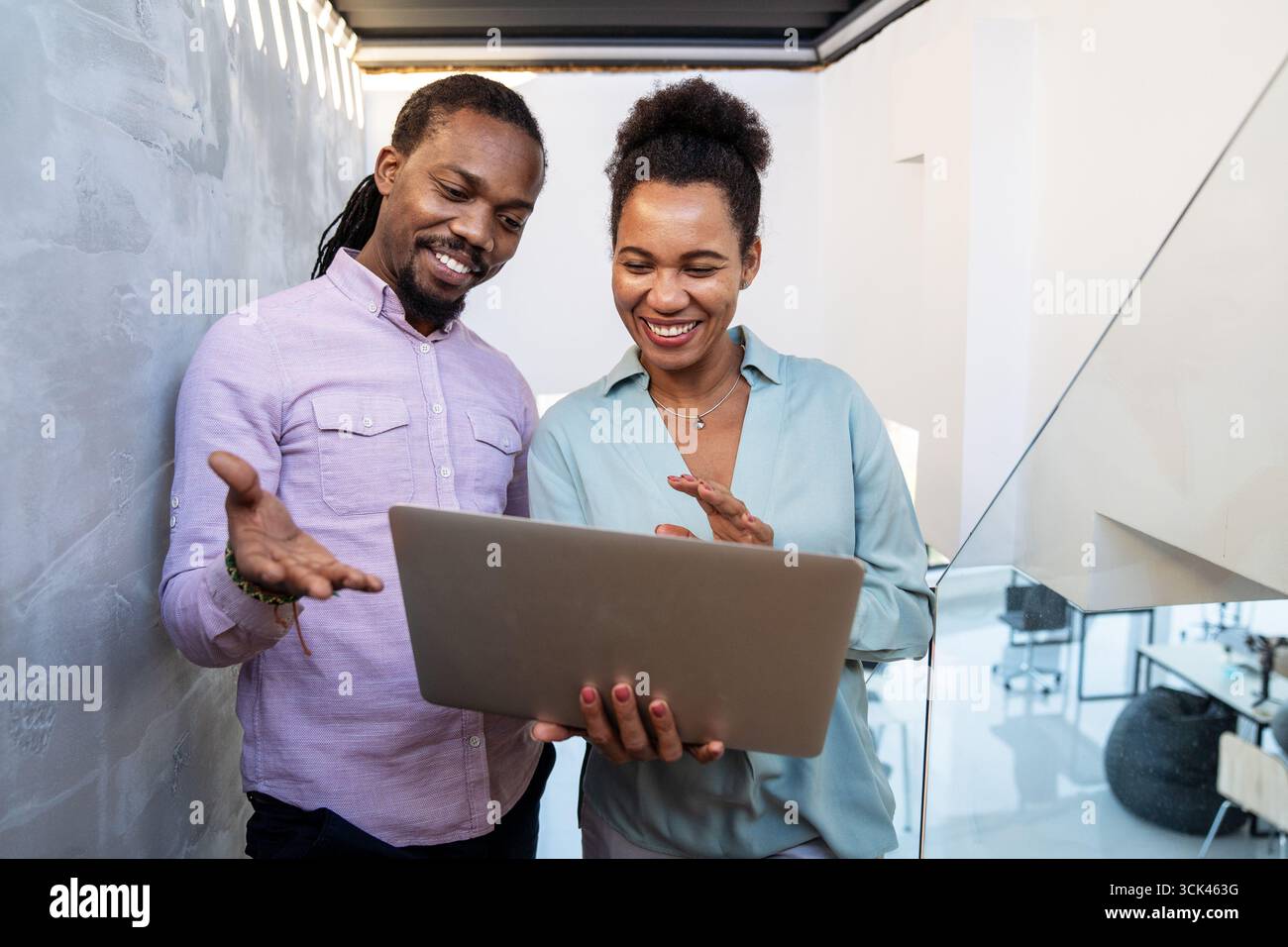 Mixed team of software engineers brainstorming ideas. Diverse app developers collaborating as group Stock Photo