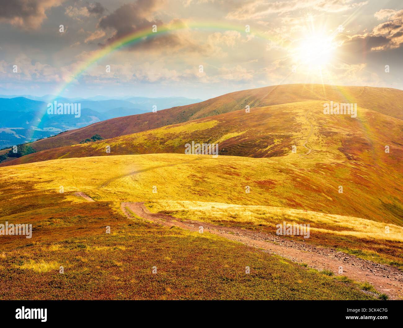 scenery of ridge in late summer at sunset. outdoor adventure. alpine landscape of mountain range in evening light. grassy meadows and rolling hills. t Stock Photo
