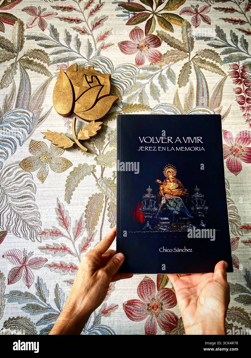 The photography book 'Volver a Vivir' of Spanish writer Chico Sánchez is shown in the famous bakery La Rosa de Oro in Jerez de la Frontera, Spain - Smartphone Captured Stock Image