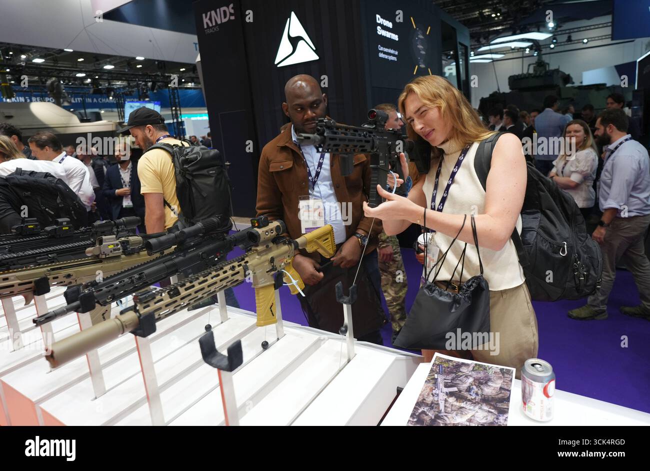 NAME BADGES PIXELATED BY PA PICTURE DESK People looking at some of the ...