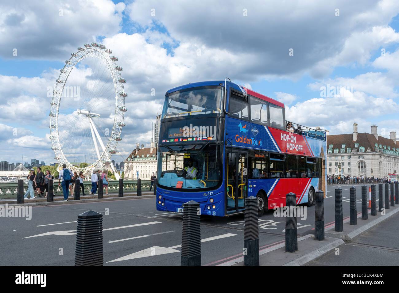 Hop on hop off sightseeing bus on Westminster Bridge with a view of The London Eye, tourism in London, England, UK Stock Photo