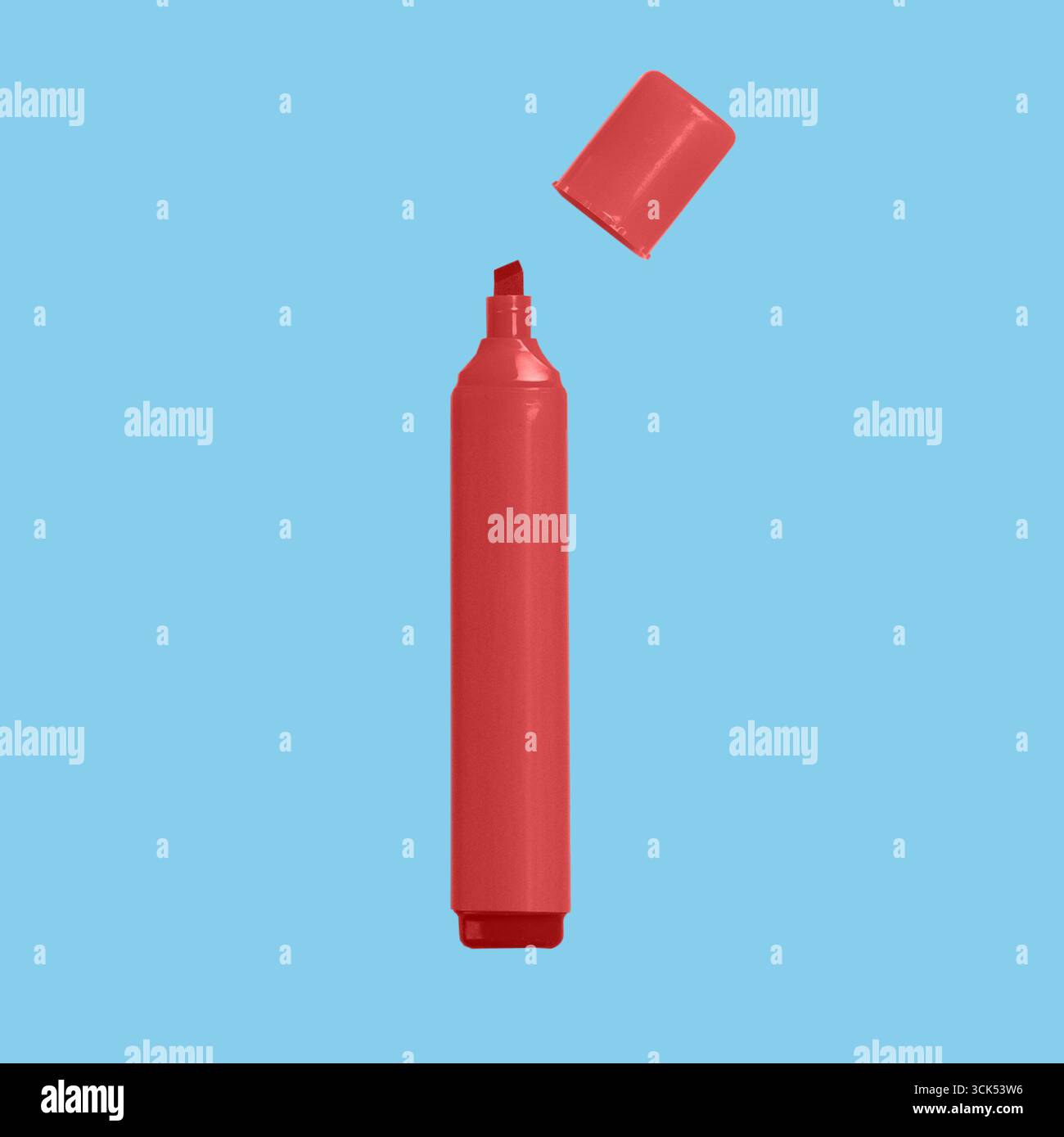 A red highlighter marker with its cap removed, ready for use in highlighting text or drawing. Stock Photo