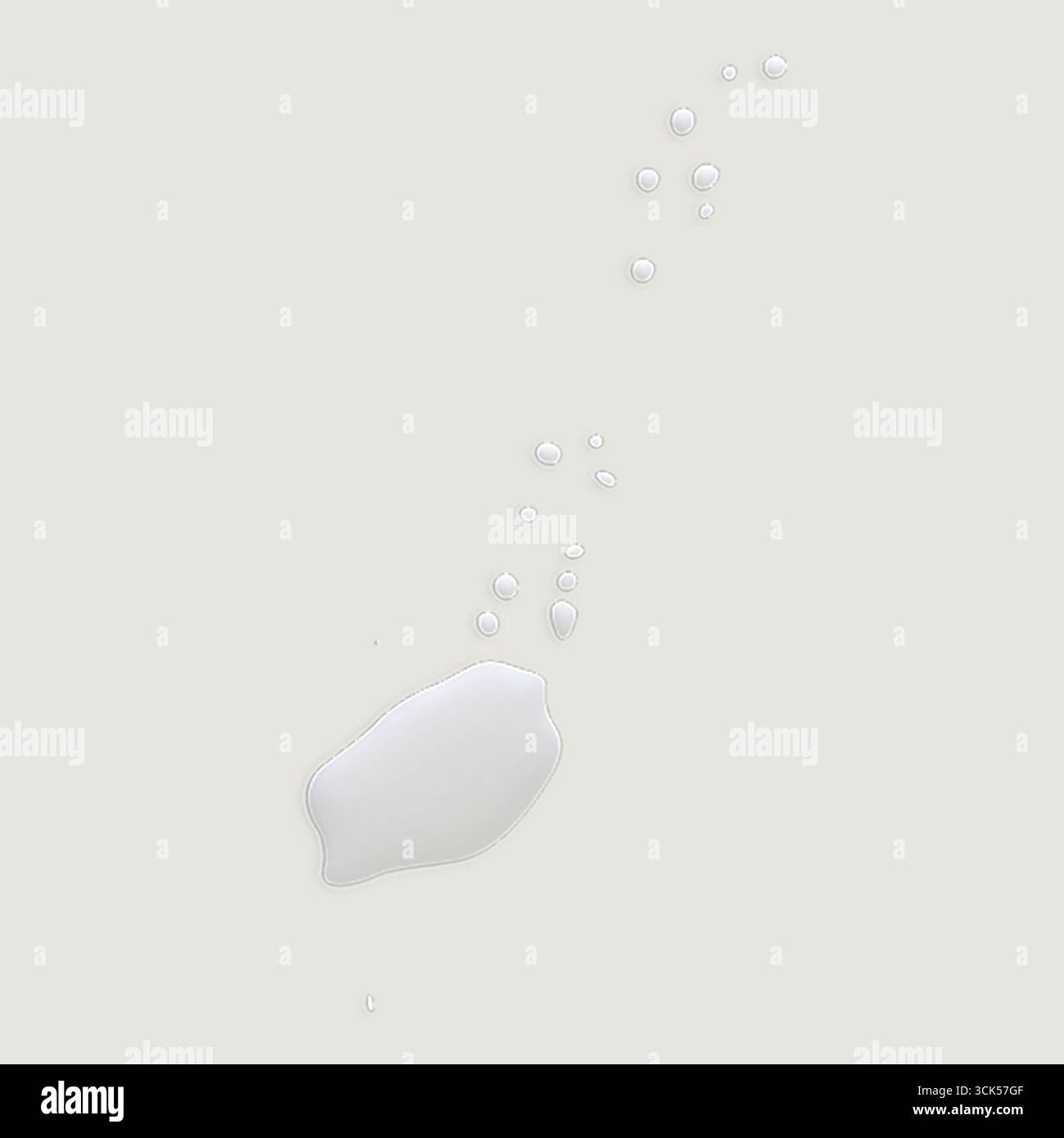 A splash of milk with droplets, illustrating fluid motion and texture. Stock Photo