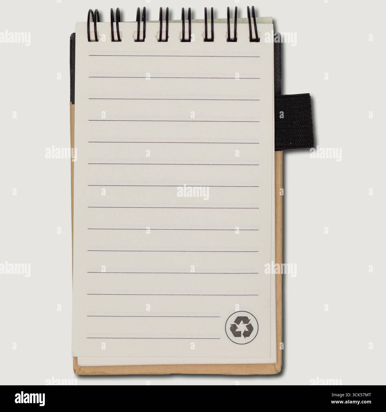A small spiral-bound notebook with blank lined pages, ideal for jotting down notes or ideas. Stock Photo