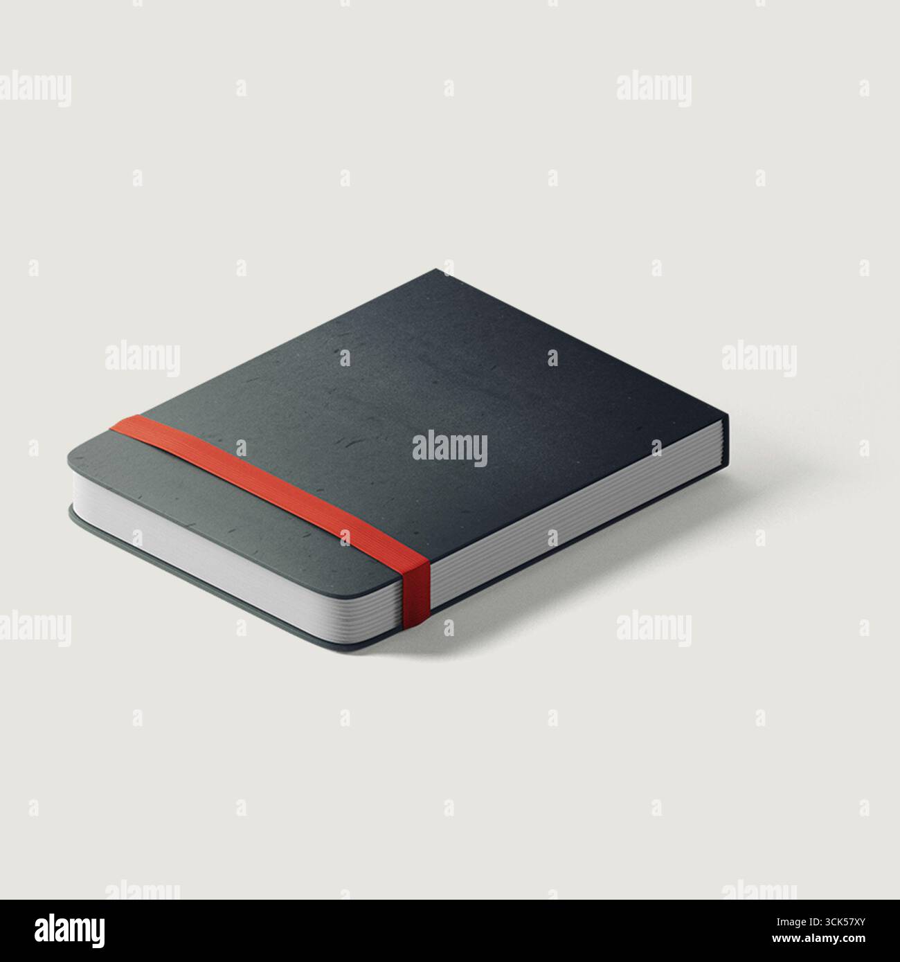 A closed notebook with a red elastic band, suggesting organization and note-taking purpose. Stock Photo