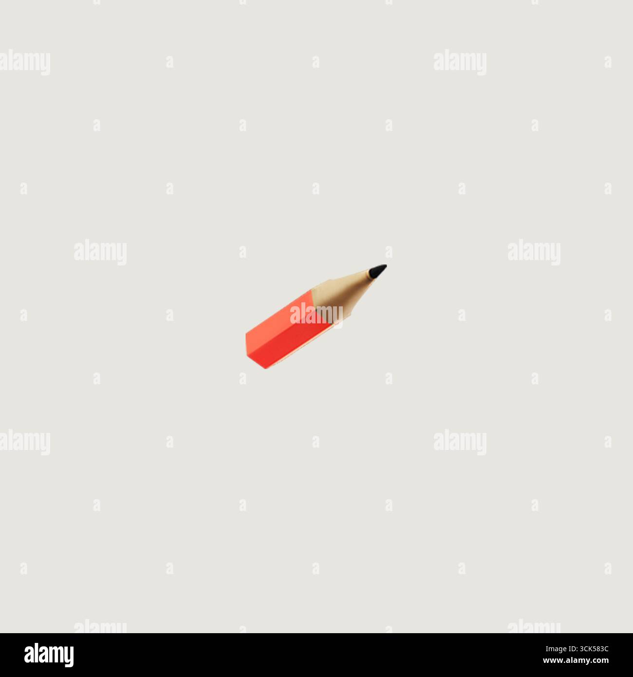 A simple red pencil with a sharpened tip, often used for writing or drawing. Stock Photo