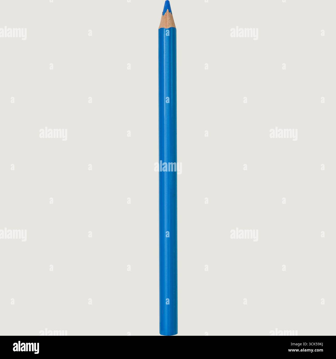 A blue colored pencil with a sharpened tip, ideal for drawing or coloring. Stock Photo