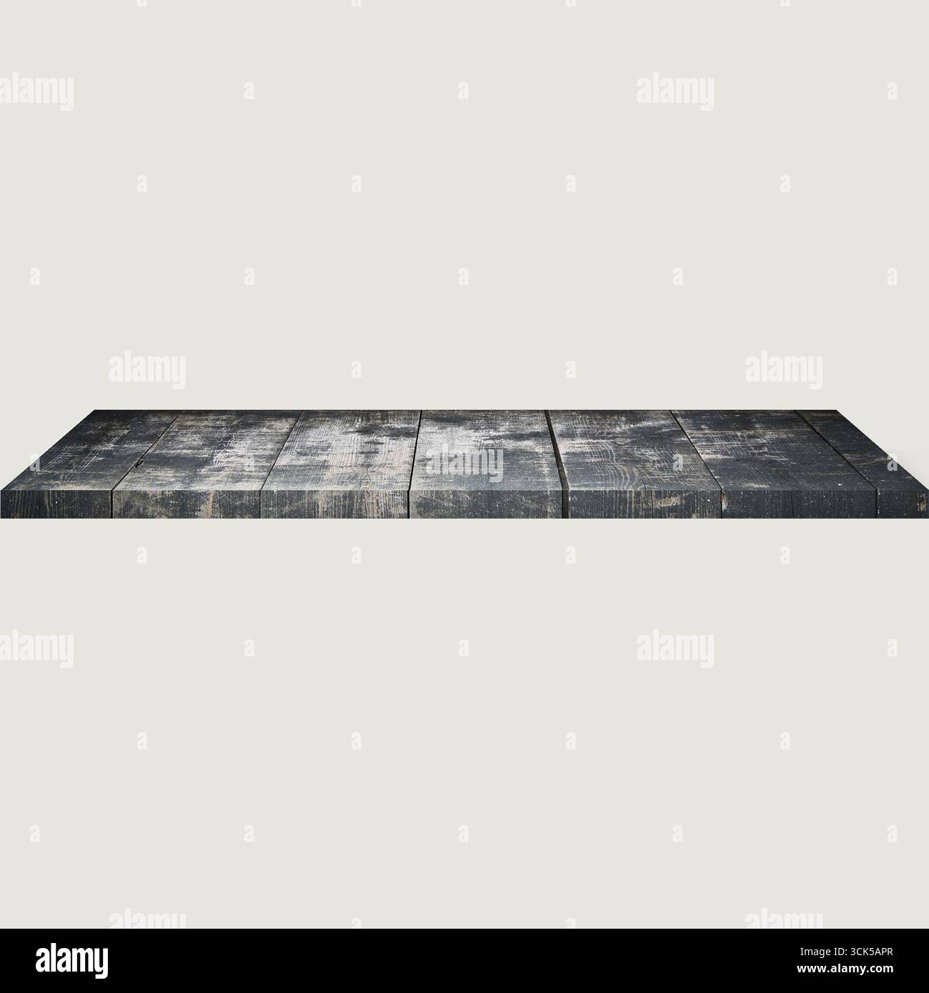 A flat, textured surface resembling a weathered wooden platform. Stock Photo