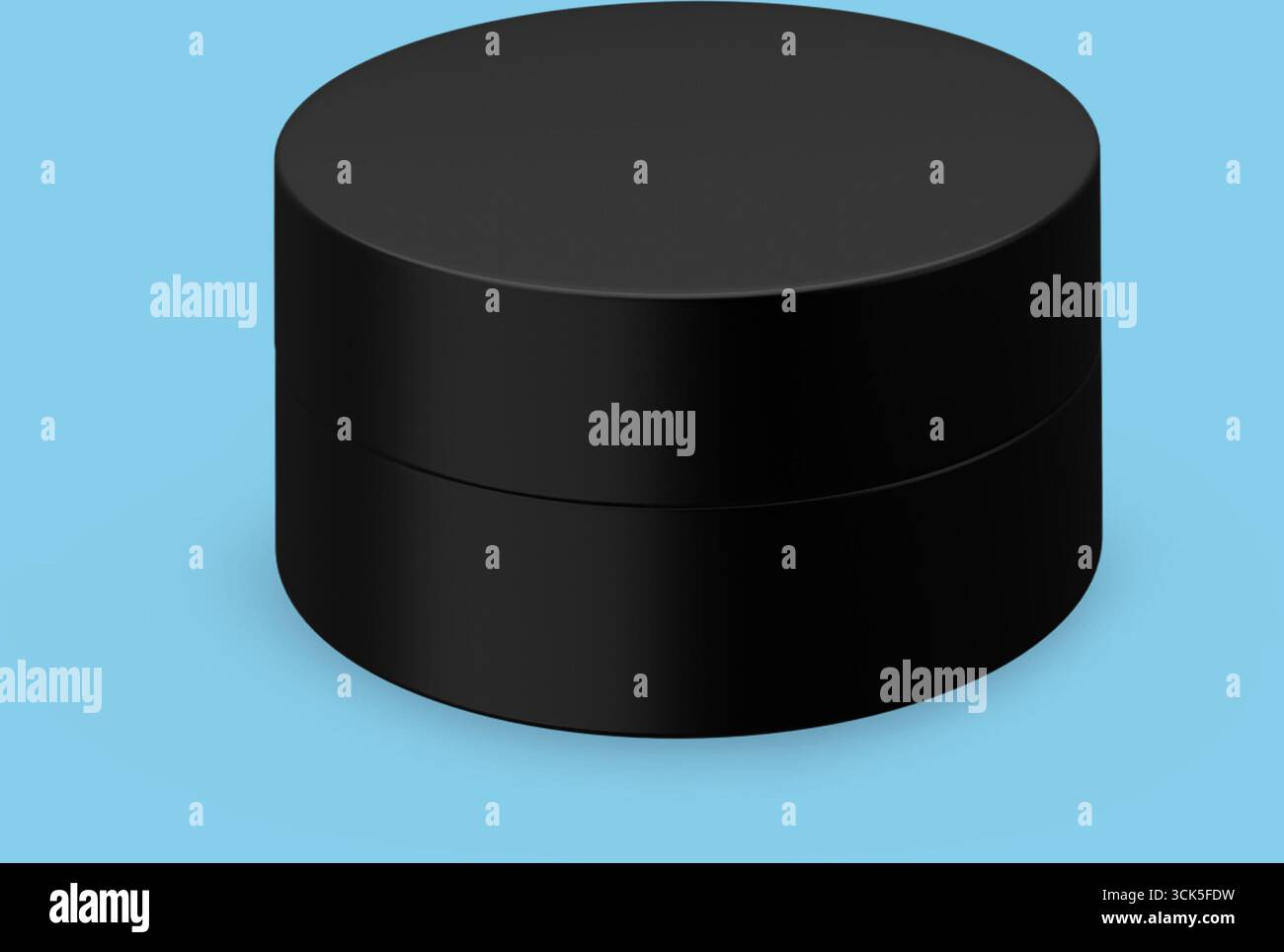 A sleek black round container with a smooth surface, designed for storage or packaging. Stock Photo