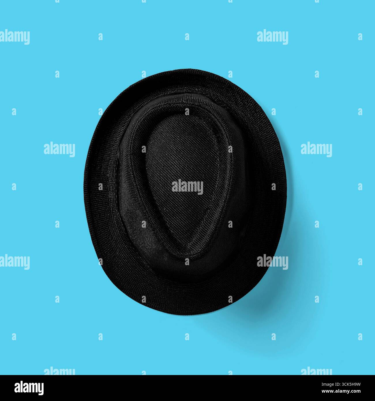 A black hat viewed from above, showcasing its unique shape and texture. Stock Photo