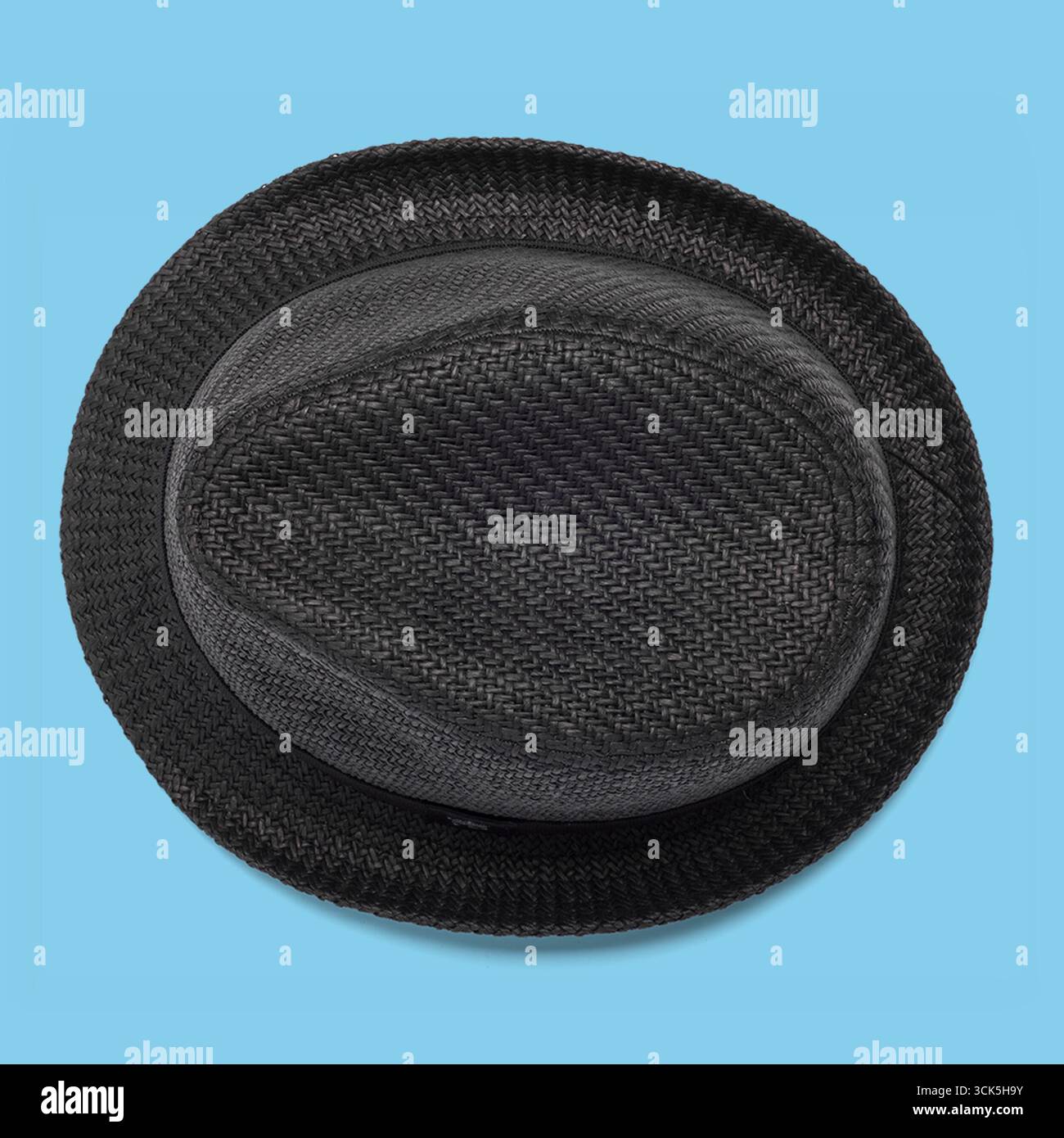 A black woven hat viewed from above, showcasing its texture and shape. Stock Photo