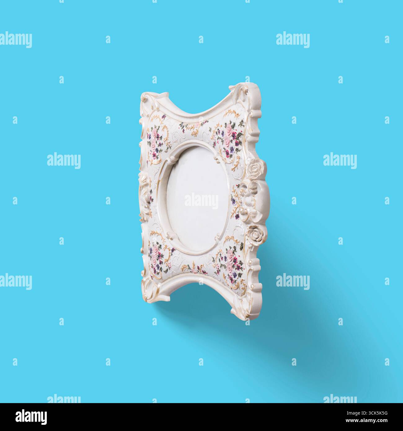 A decorative photo frame with intricate floral designs, designed to display cherished memories. Stock Photo