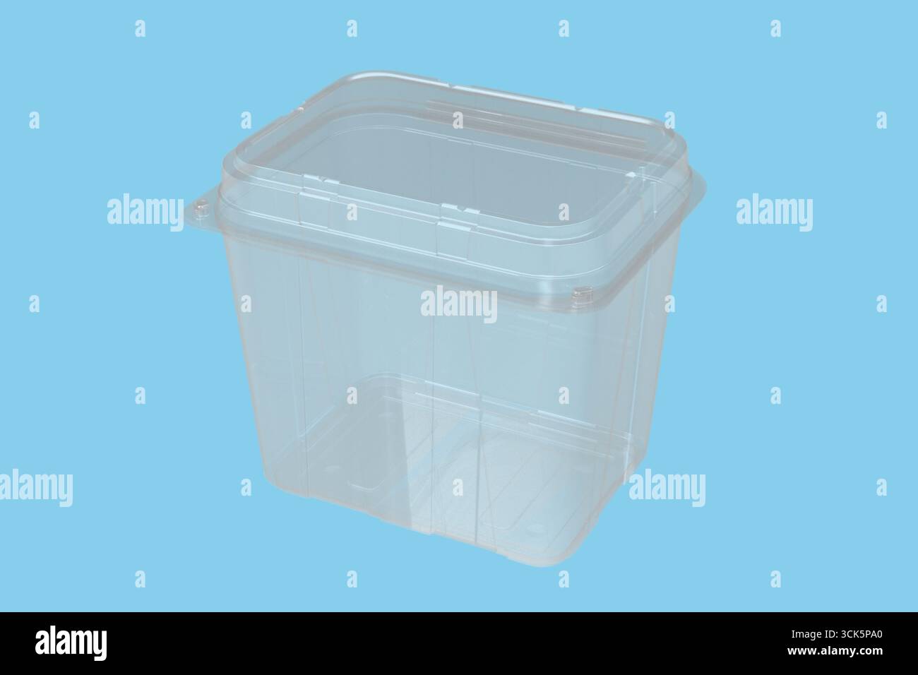 A transparent plastic container with a square shape, designed for storage and organization. Stock Photo