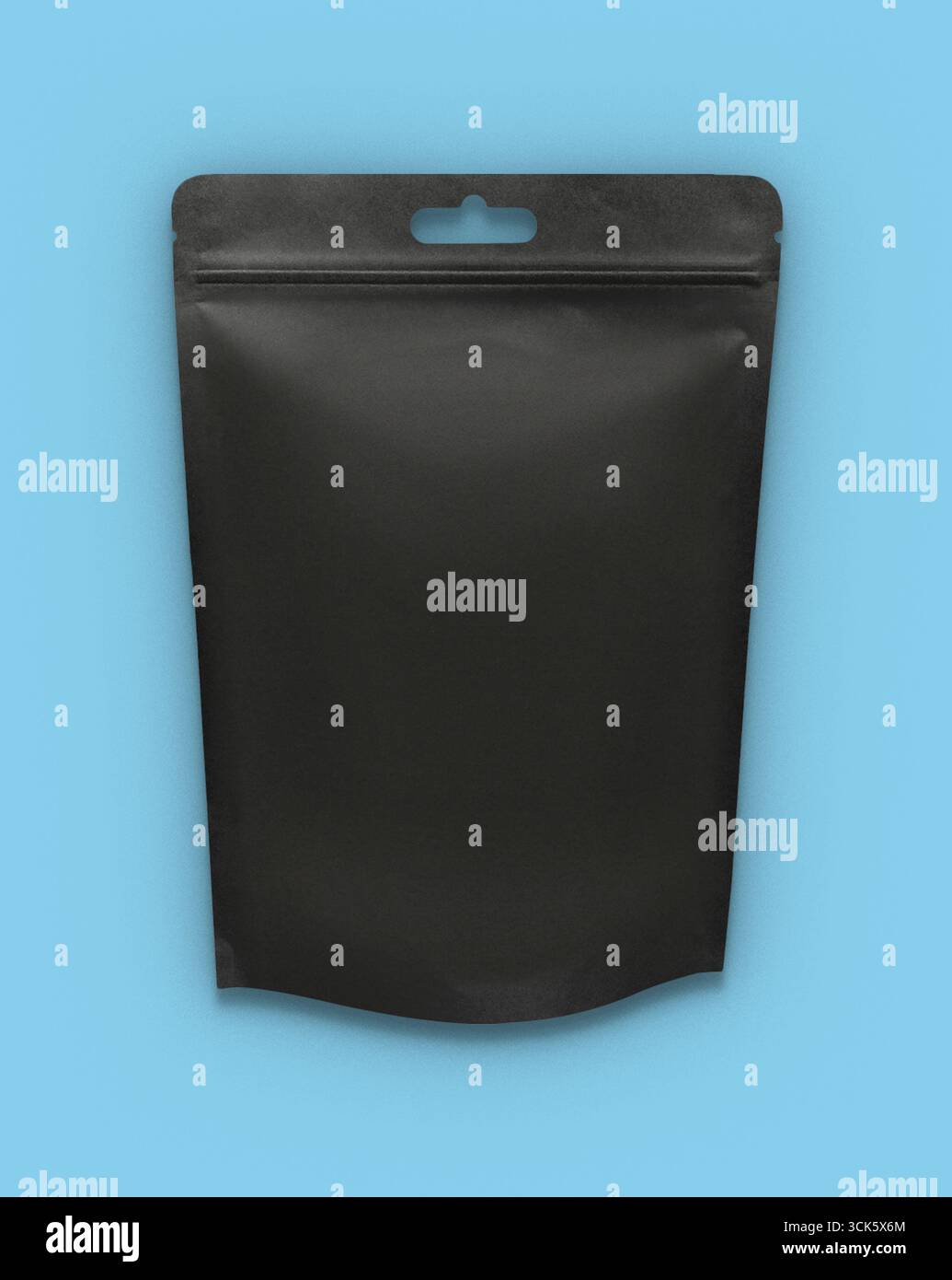 A plain black packaging pouch designed for various products. Stock Photo
