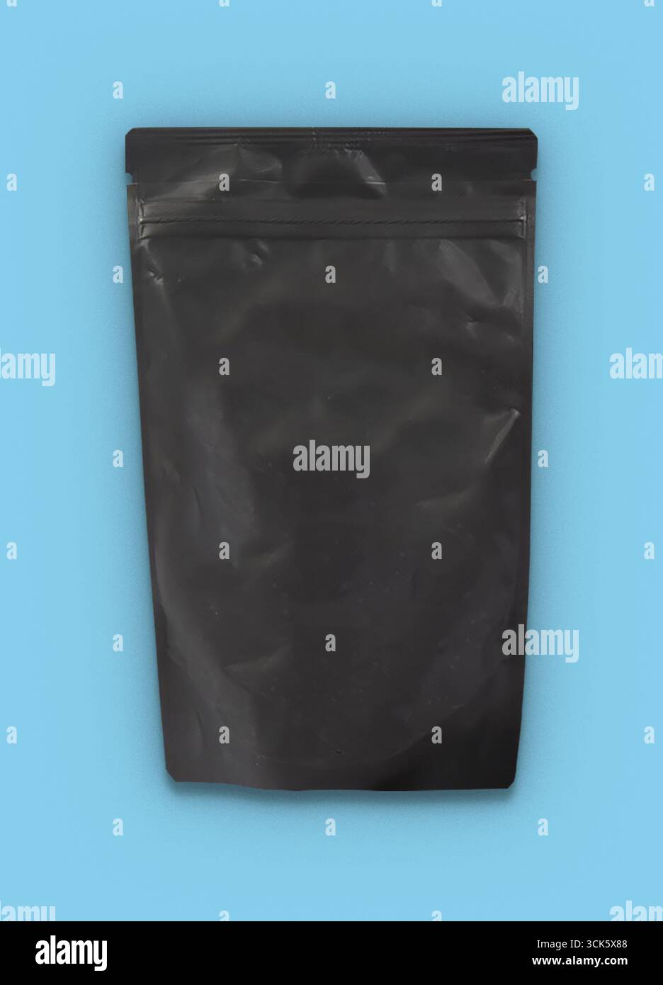 A plain black resealable pouch designed for packaging various products. Stock Photo