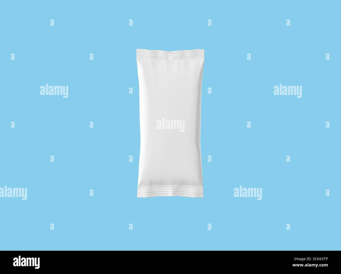 A plain, sealed white packet, potentially for food or other products, designed for packaging and storage. Stock Photo
