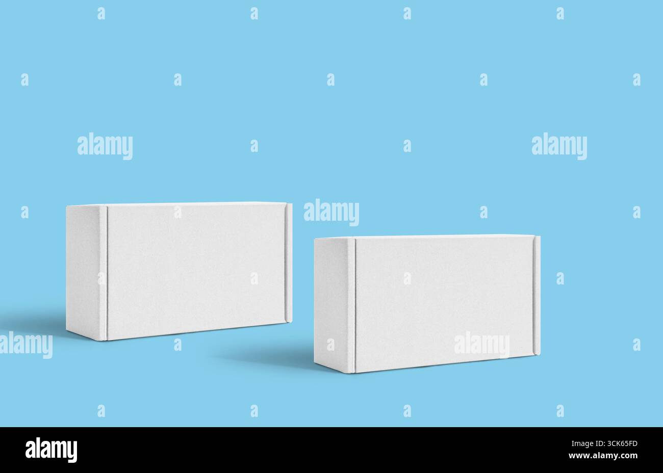 Two plain white rectangular boxes positioned side by side, suggesting packaging or storage. Stock Photo