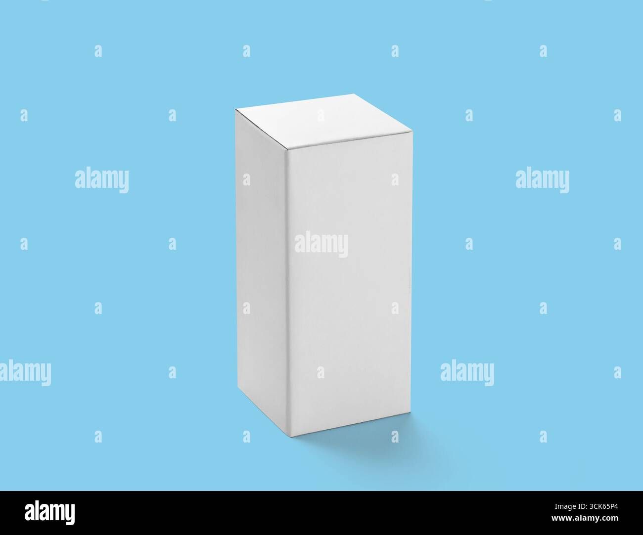 A plain white box with a rectangular shape, often used for packaging or storage purposes. Stock Photo