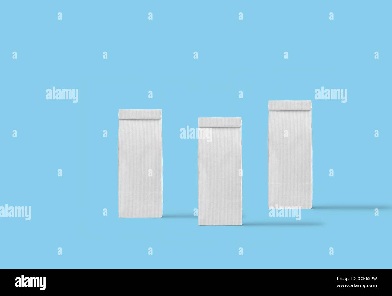 Three plain rectangular packages arranged in a row, likely for packaging or storage purposes. Stock Photo