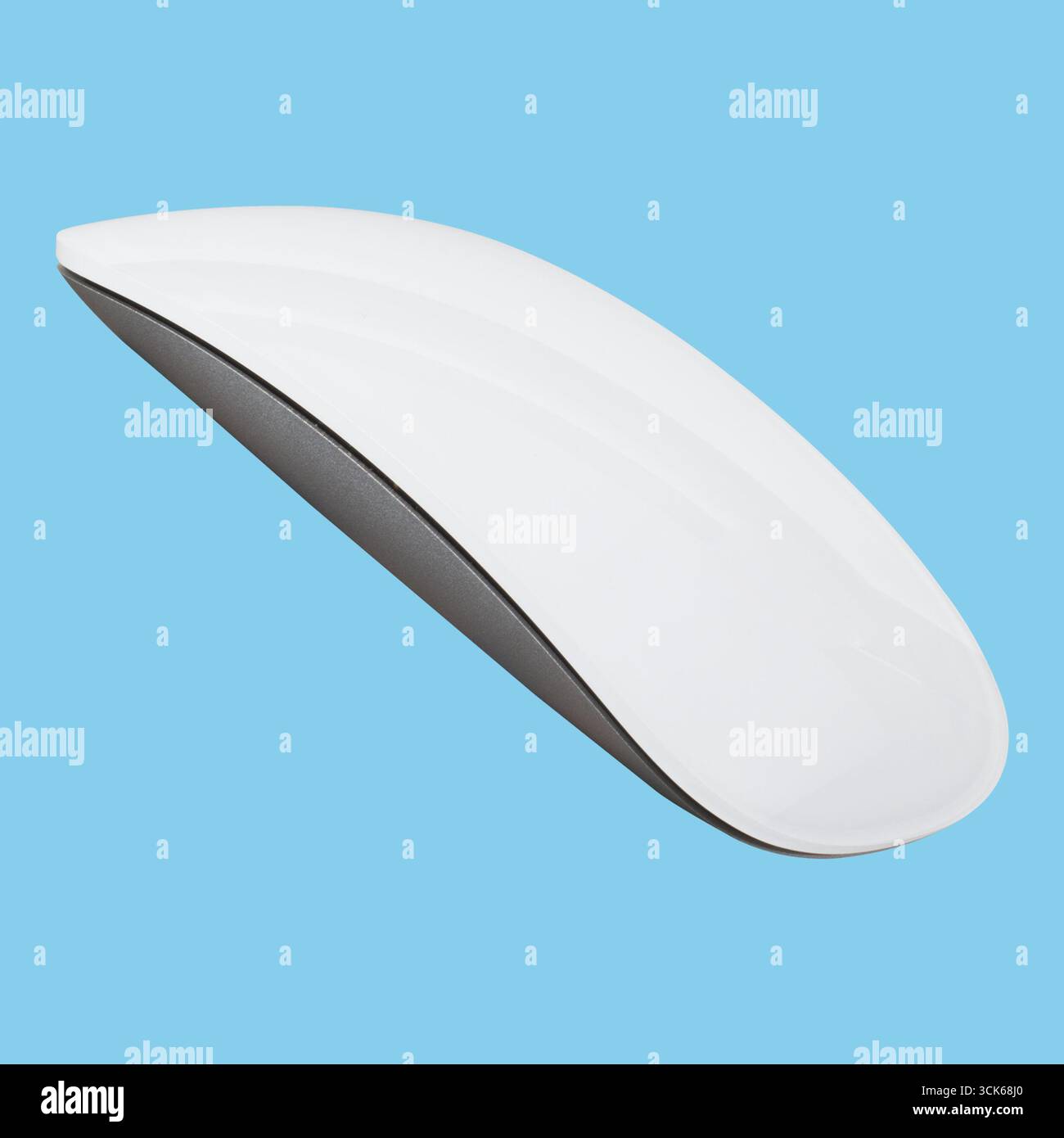 A sleek, modern wireless computer mouse designed for ergonomic use and efficiency. Stock Photo