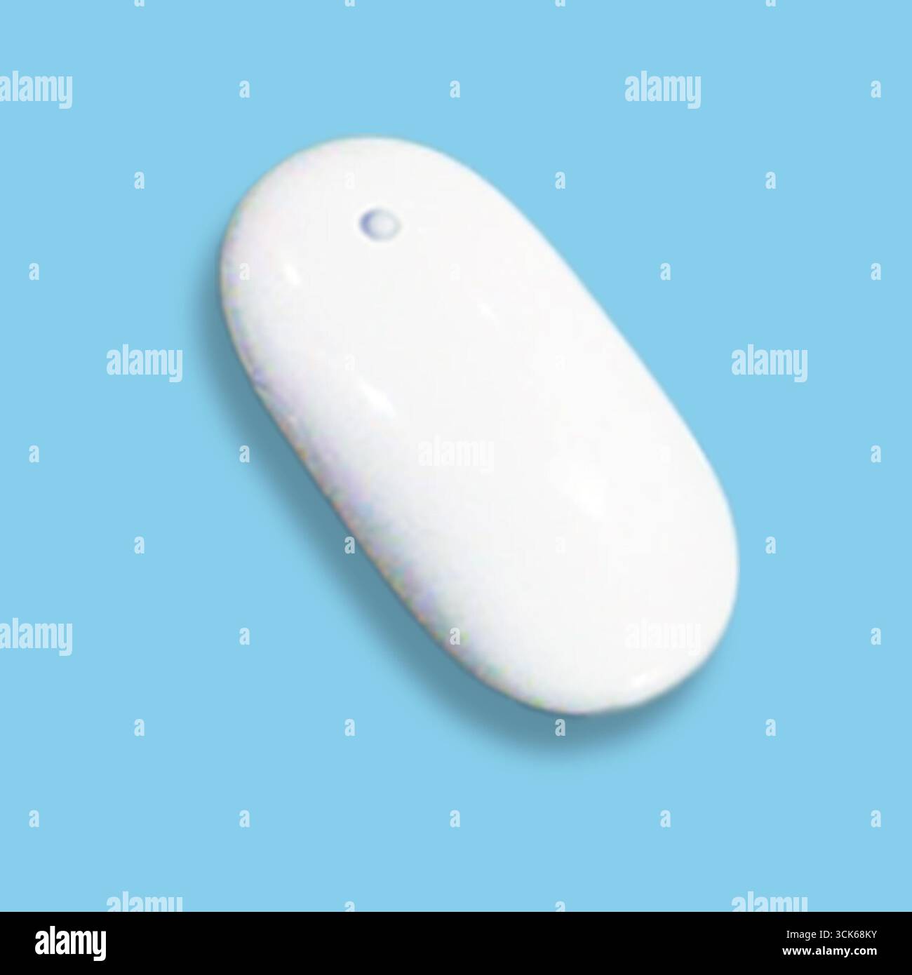 A sleek, white computer mouse designed for ergonomic use and efficient navigation. Stock Photo