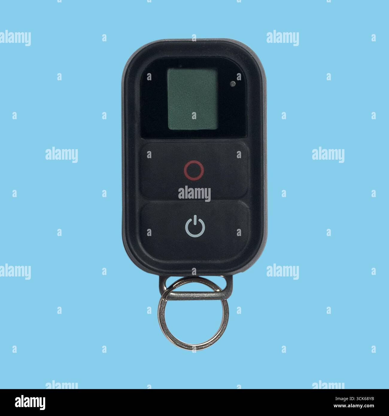 A compact remote control device featuring a small display and buttons for operation. Stock Photo