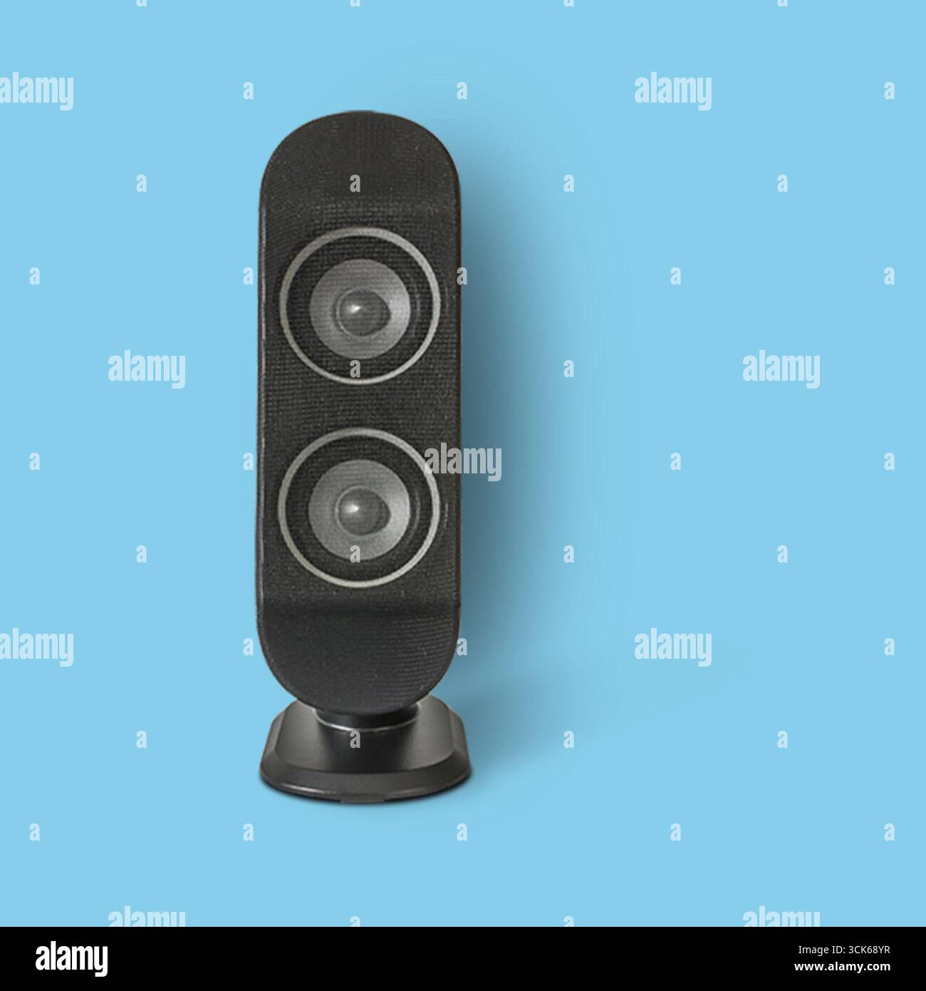 A sleek black speaker with dual drivers designed for audio playback. Stock Photo
