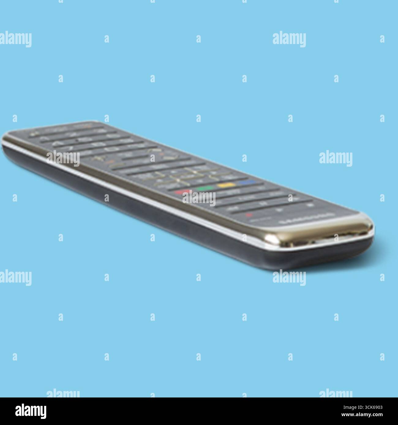 A sleek remote control featuring various buttons for navigation and functionality, designed for operating electronic devices. Stock Photo