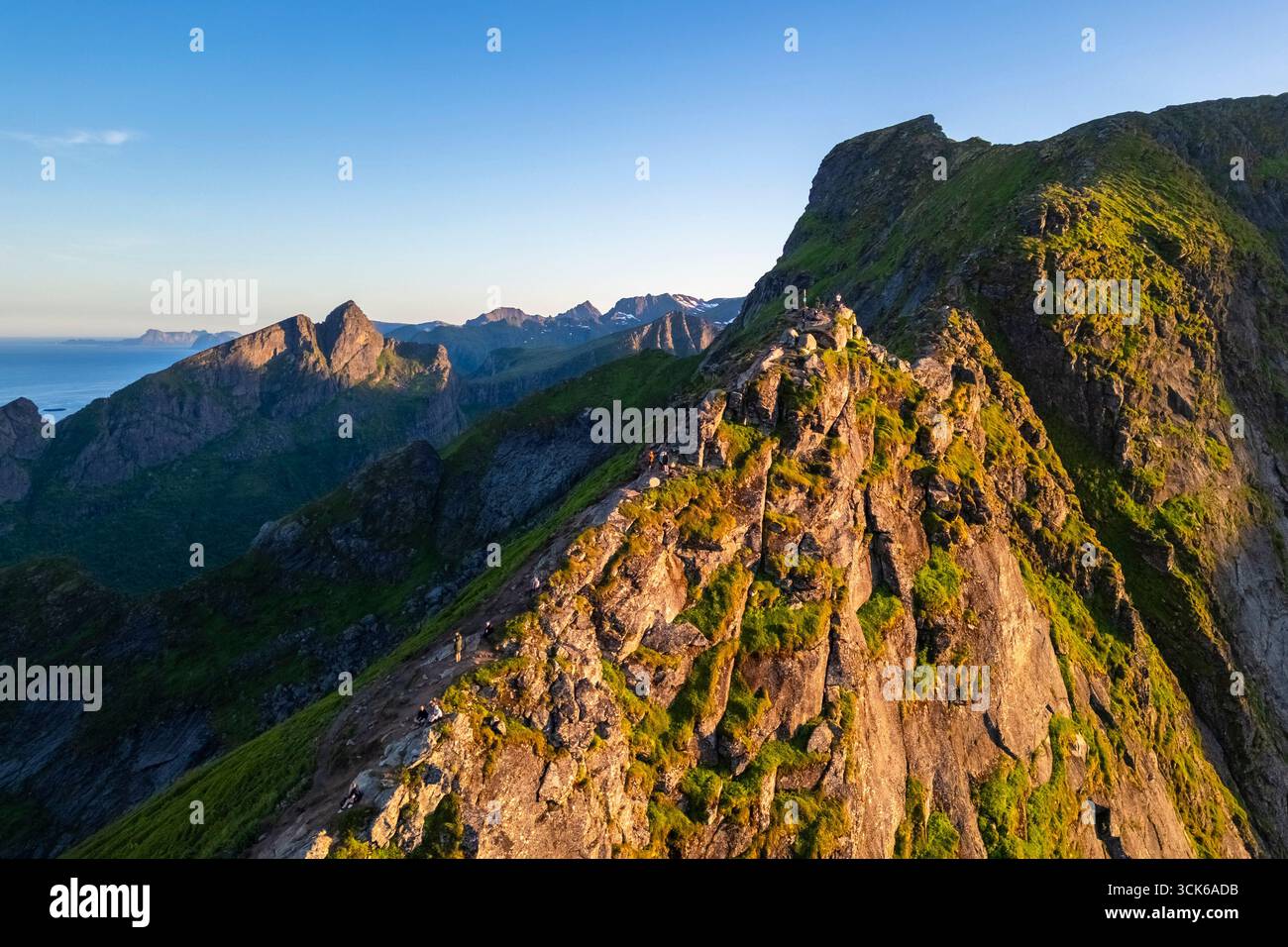 Aerial view at sunset of Reine Bay from the rocky peak of Reinebringen. Reine, Moskenes, Nordland, Lofoten Islands, Norway. Stock Photo