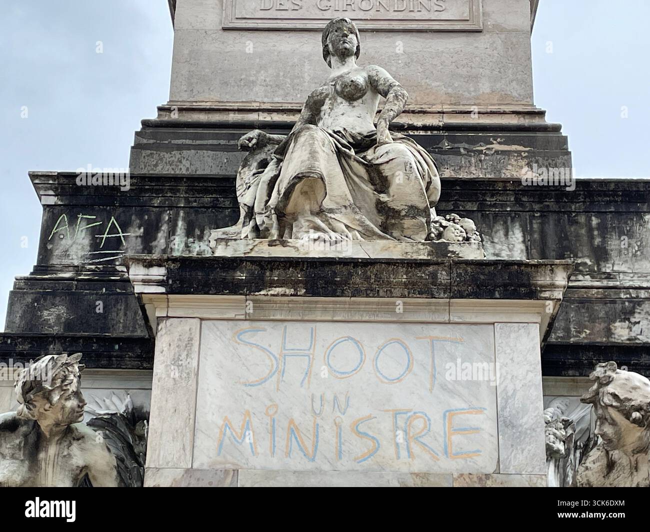 'SHOOT A MINISTER' Inscriptions on the Girondins monument in Bordeaux made by protesters from the 'Block Everything' movement on September 10, 2025. - Smartphone Captured Stock Image