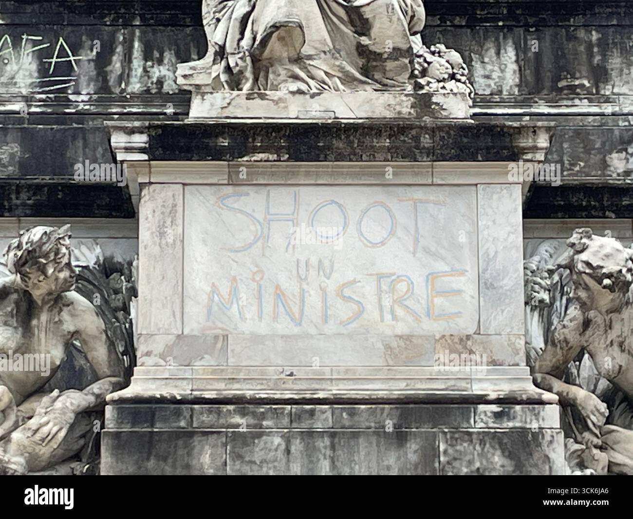 'SHOOT A MINISTER' Inscriptions on the Girondins monument in Bordeaux made by protesters from the 'Block Everything' movement on September 10, 2025. - Smartphone Captured Stock Image