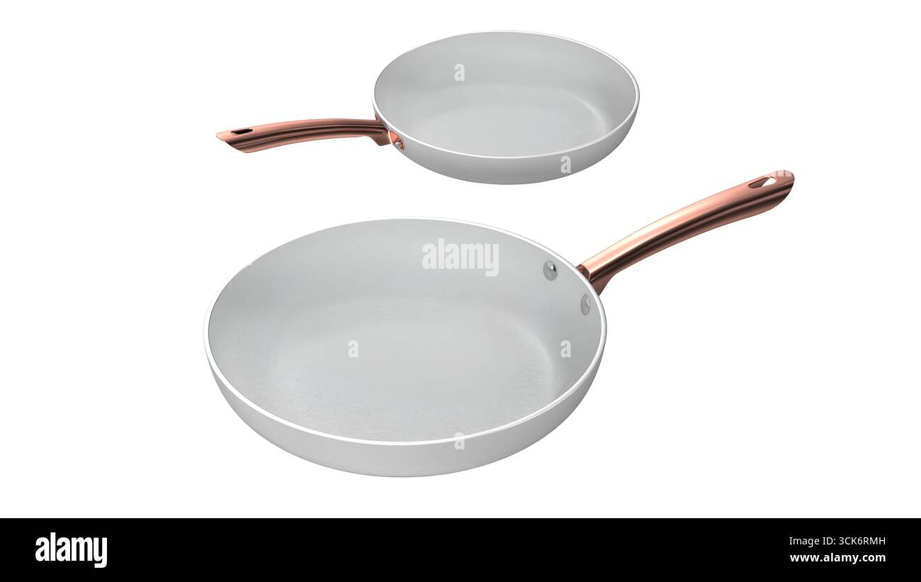 Two elegant frying pans with white surfaces and copper handles, designed for cooking. Stock Photo