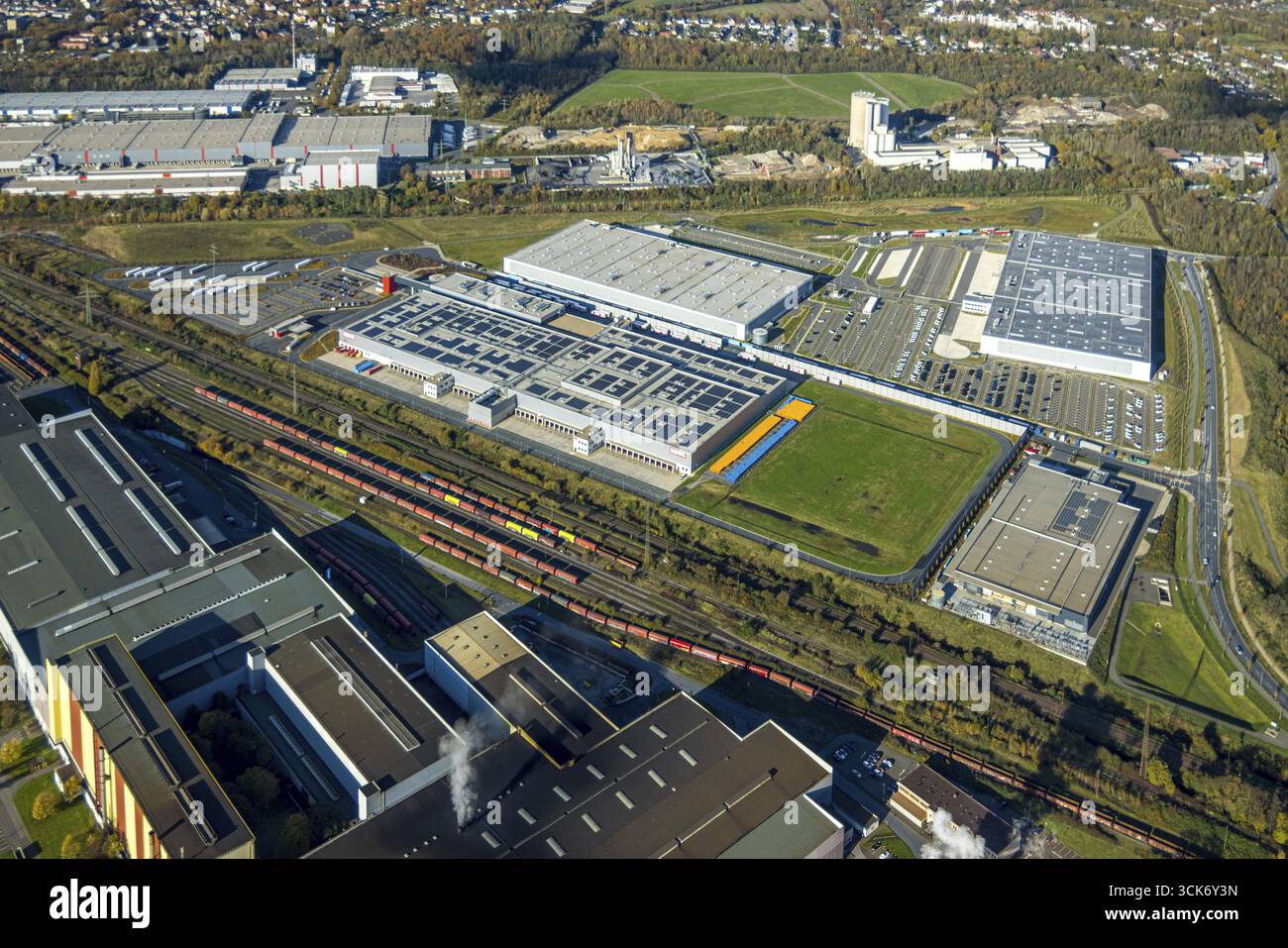 Aerial view, development, industrial estate Westfalenhuette sinter plant with Bergisch-Westerwaelder Hartsteinwerke and the logistics companies Rewe w Stock Photo