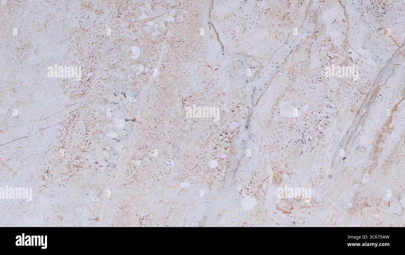 This image features a smooth, light-colored marble surface with subtle veining, suitable for interior design and architectural applications. Stock Photo