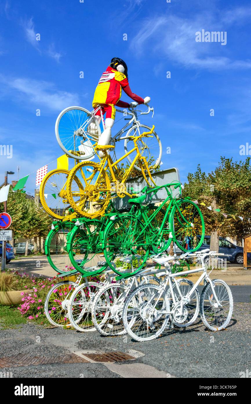 Ten painted bicycles with stuffed figure on top erected for passing of the 2025 Tour de France through village - Martizay, Indre (36), France. Stock Photo