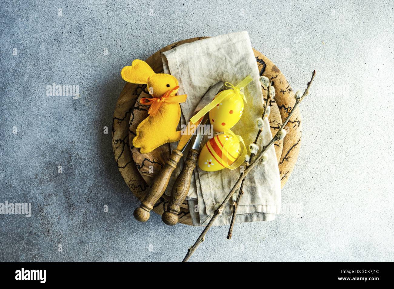 Easter dinner table settinf with colored eggs served on the table Stock Photo