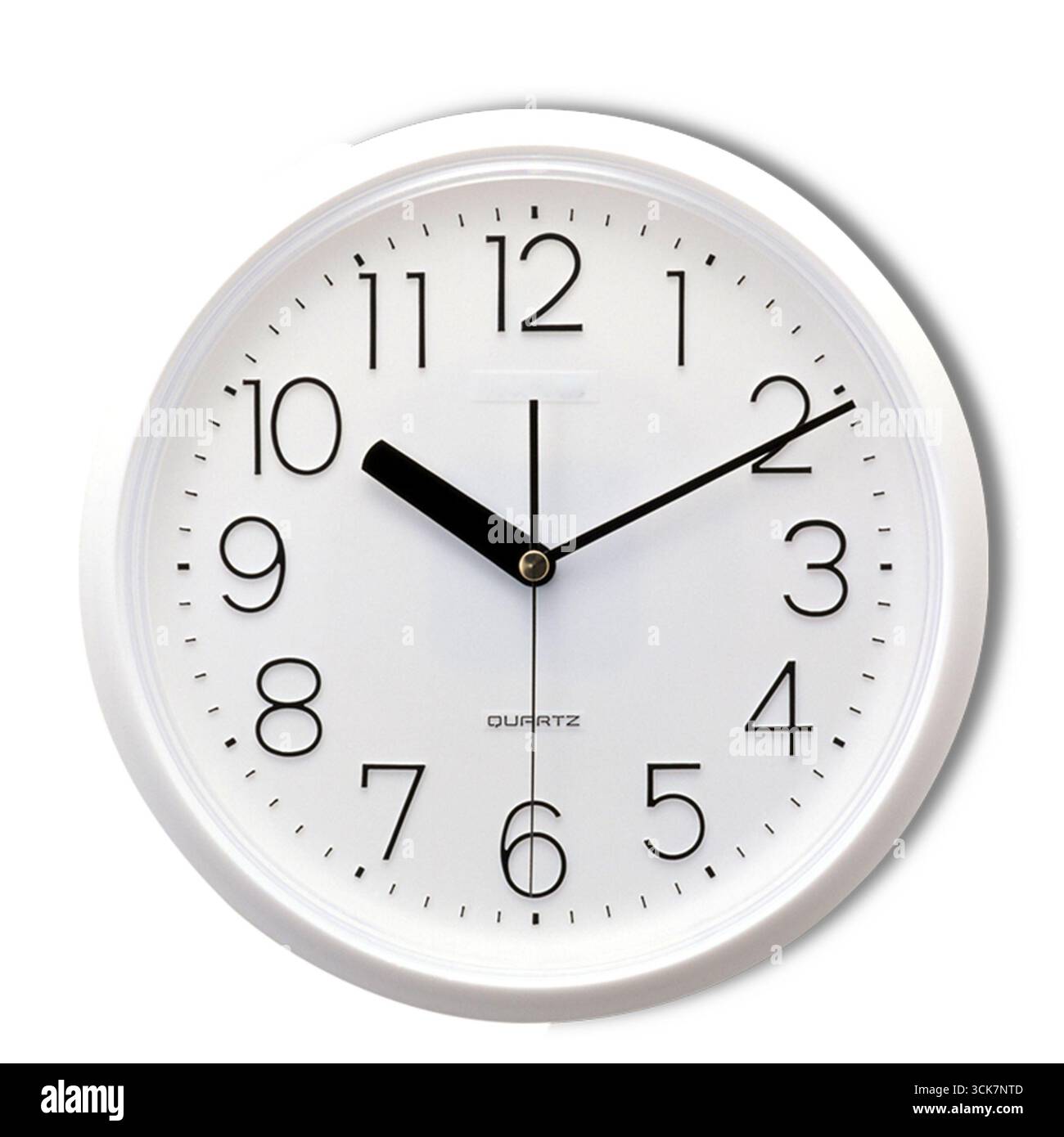A round wall clock displaying the time with clear numbers and hands. Stock Photo