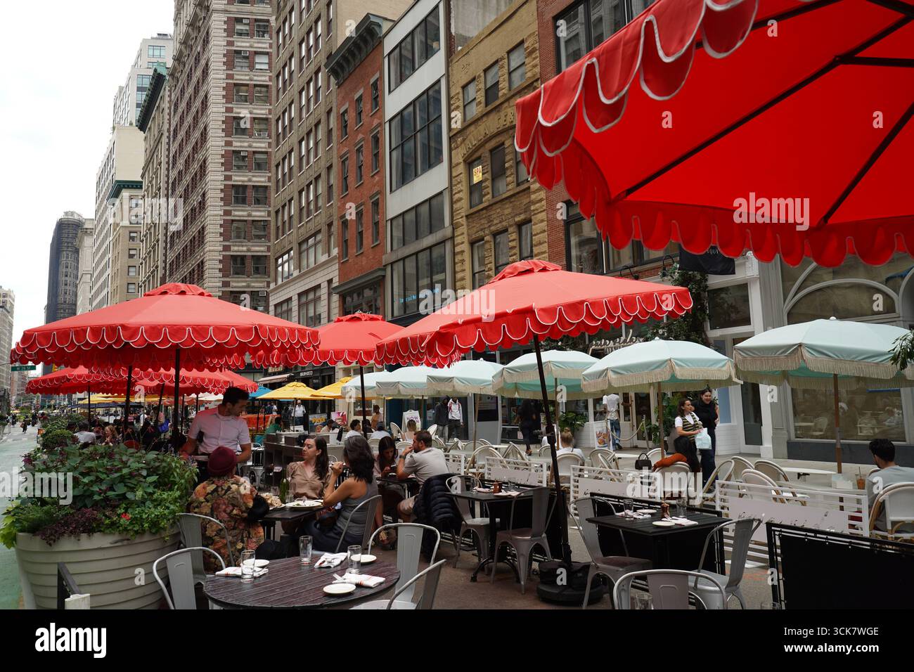 Broadway in midtown Manhattan, a pedestrianized street with outdoor seating for restaurants Stock Photo
