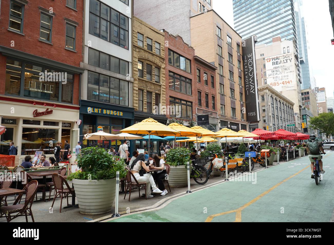 Broadway in midtown Manhattan, a pedestrianized street with outdoor seating for restaurants Stock Photo