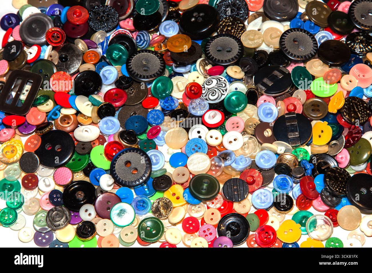 Multi-colored buttons on a white background close-up. Stock Photo