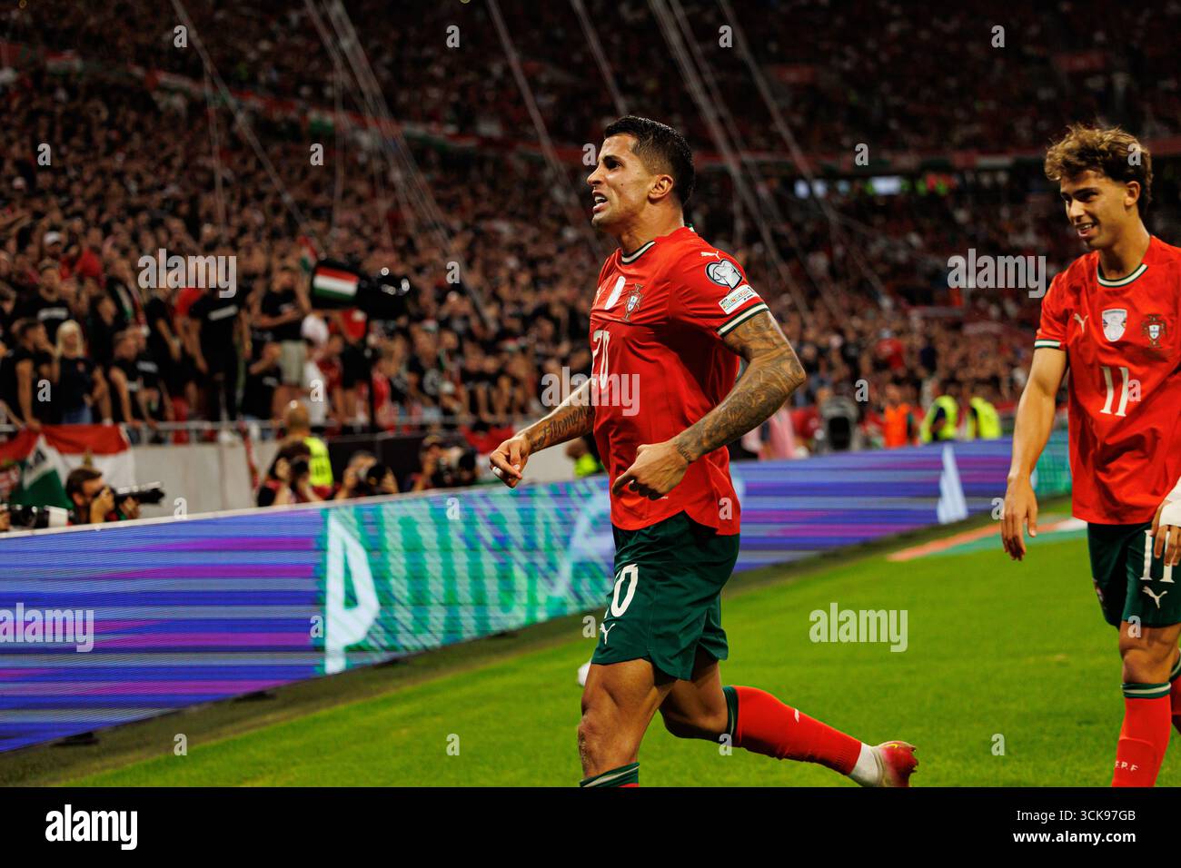 Joao Cancelo and Joao Felix seen celebrating after scoring goal during
