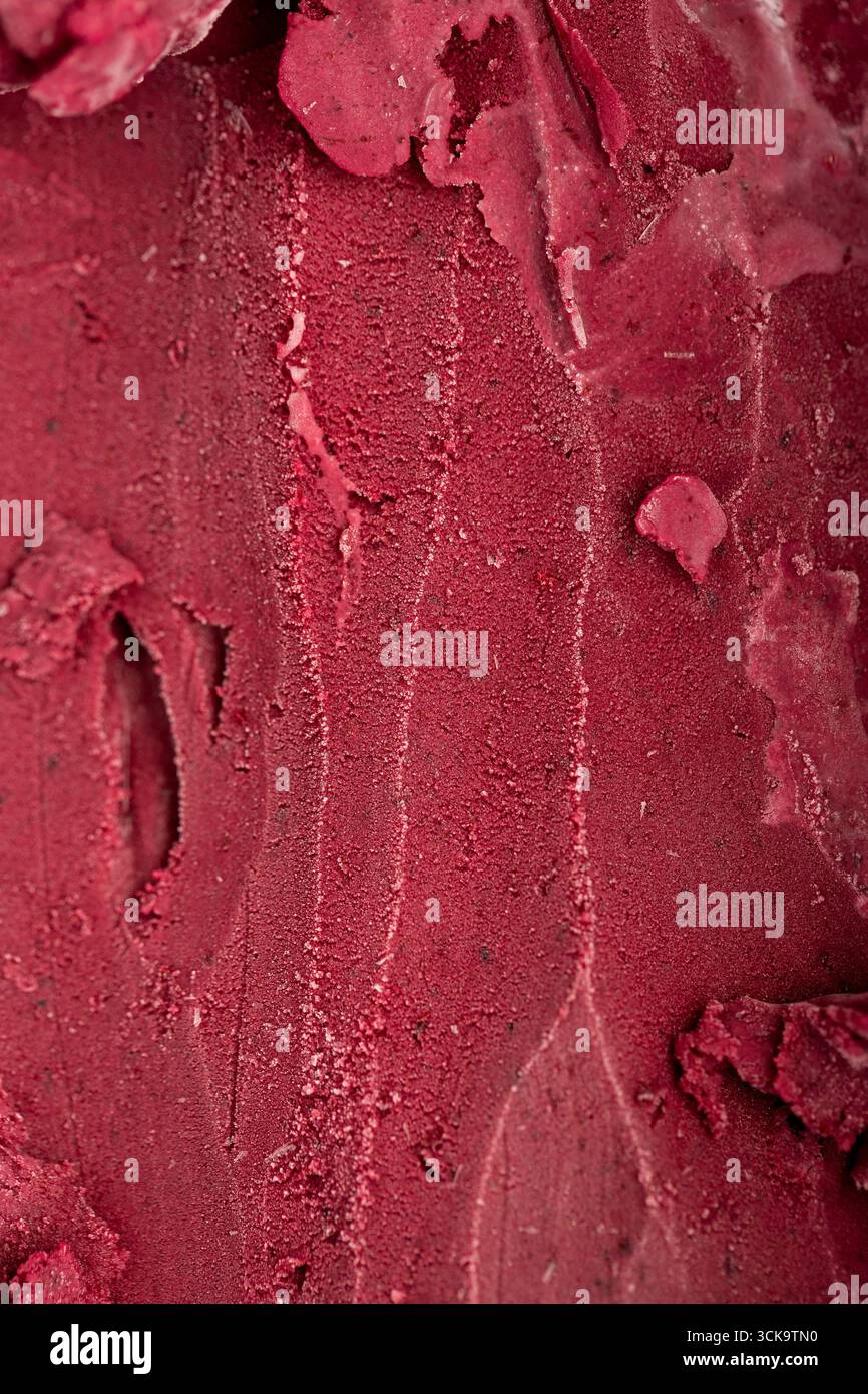 Close-up texture of rich red berry sorbet, vibrant and refreshing frozen dessert background Stock Photo