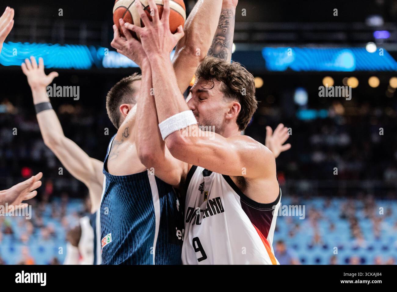 Luka Doncic (C) of Slovenia and Franz Wagner (R) seen in action during ...