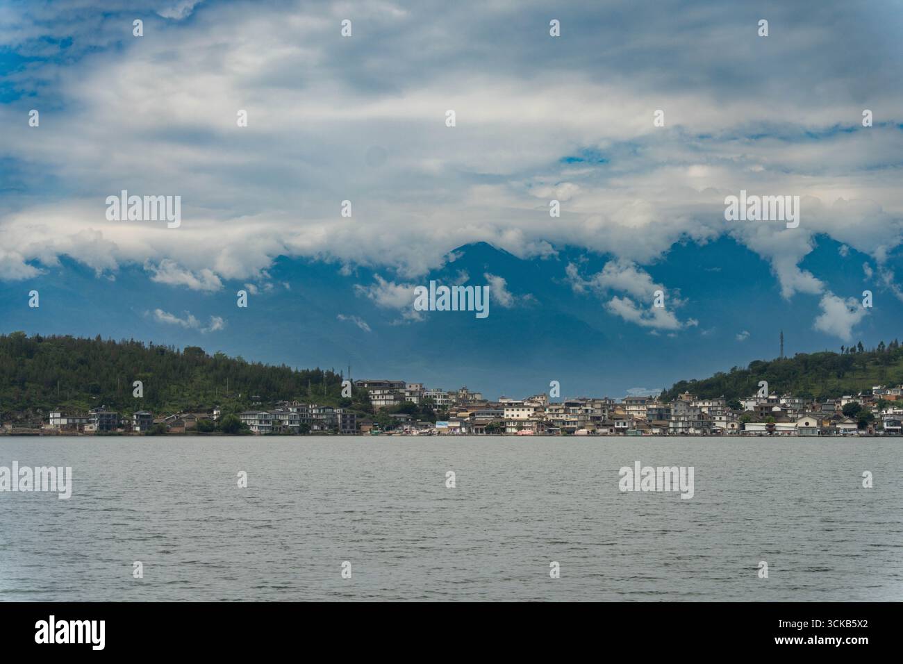 Jinsuo Island, located in the center of Erhai Lake, is famous for its picturesque location surrounded by clear, mirror-like waters. Stock Photo