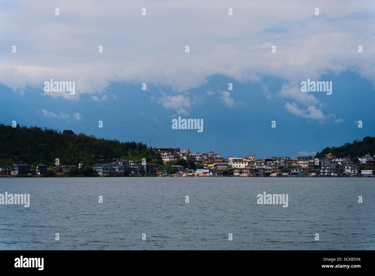 Jinsuo Island, located in the center of Erhai Lake, is famous for its picturesque location surrounded by clear, mirror-like waters. Stock Photo